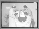 [Doctor and Nurse Examine X'Ray]