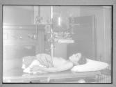 A Child Under X'Ray In A Hospital Old Time X'Ray Set-up In Clinic 1915