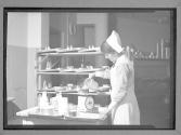[Nurse Measures Meal]
