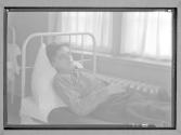 [Boy in Hospital Bed]