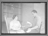 [Man Reading to Woman]