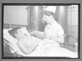 [Nurse with Boy, Artificial Limb]