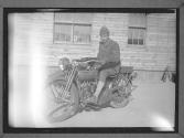 [Man on Motorcycle]