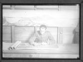 [Soldier Writing in a Conference Room]
