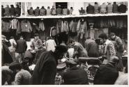 Just after prayers at mosque in market, people are getting up from prayers, Konya, Turkey
