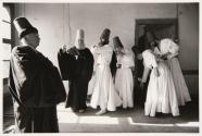 Dervish dancers get ready to dance in an old Dervish building (forbidden religious sect), Konya, Turkey