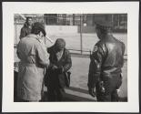 [Police with man]