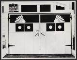 [Decorative garage door with "No Parking" sign]