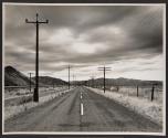 [Highway with electrical wires]