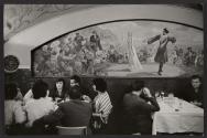 [Groups dining at restaurant with mural, Moscow]