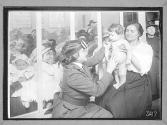 [Dr. Boness with Children]