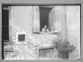 Chateaux-Child in Window