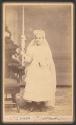 [Girl in First Communion dress]