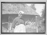 [Peasant Woman Near Hut]