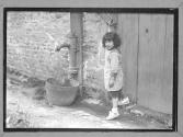 [Children by Spigot in Street]