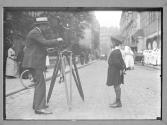 [Unid. Photographer with Pathe Camera]