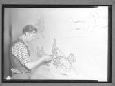 [Man Drawing on Chalk Boards]