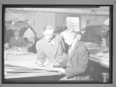 [Two Men with Maps]