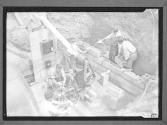 [Men Working on Brick Foundation]