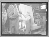 [Man with Sheet of Rubber]