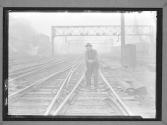 [Man Switching Railroad Tracks]