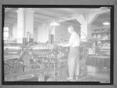 [Man at Press]