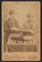 [Snuff salesmen posed taking orders for their products]