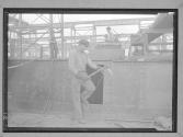 Riveter on Side of Boat