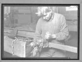 Repairman In Packard Service Station Working On Truck Chasis