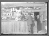 [Man in Liquor Store]
