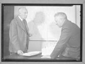 [Two Men With Maps]