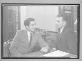 [Two Men in an Office]