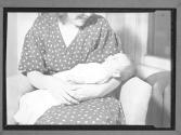 [Woman Holding Child]