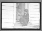 [Woman, Child in Doorway]