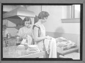 [Two Women Washing Dishes]