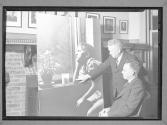 [Two men with Lewis Hine photo]