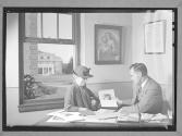 [Man and Woman Viewing Photographs]