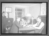 [Men Playing Cards at Social Club]