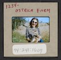 [Peggy Muray holding a small ostrich, Oudtshoorn, South Africa (travel slide)]