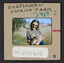 [Peggy Muray holding a small ostrich, Oudtshoorn, South Africa (travel slide)]