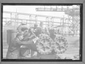 [Worker Turning Wheel]