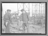 [Two Workers, Machine]