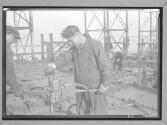 [Two Workers, Machine]