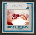 [Peggy Muray's cat George with a bird (travel slide)]