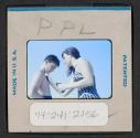 [People applying sunscreen (travel slide)]