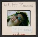 [Mimi Muray lying on a beach, West Hampton, New York (travel slide)]