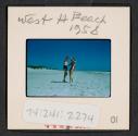 [Nicholas Christopher and Mimi Muray on a beach, West Hampton, New York (travel slide)]
