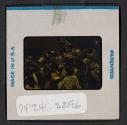 [People seated indoors (travel slide)]