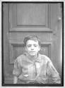 [Portrait of Boy in Doorway]