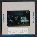 [People seated in formal wear (travel slide)]
